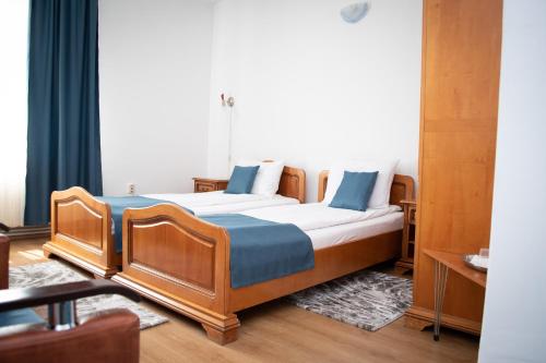 Postel nebo postele na pokoji v ubytování Motel Via Targu Mures