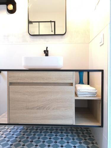 a bathroom with a sink and a mirror at Torre con vistas in Tossa de Mar