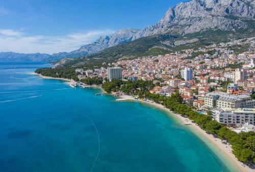 an aerial view of a city on the beach at Hotel Park Makarska in Makarska