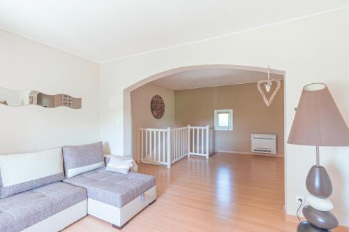 a living room with a couch and a table at Mas de l'Olivier - Enclave des Papes - Visan - 8 couchages in Visan