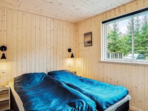 En eller flere senge i et værelse på Holiday home Frederiksværk VI