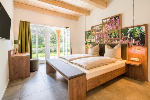 Ένα ή περισσότερα κρεβάτια σε δωμάτιο στο Heidjers Hus Undeloh