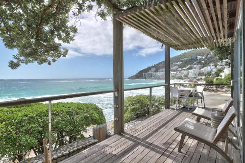 a wooden deck with a view of the ocean at Wixy in Cape Town