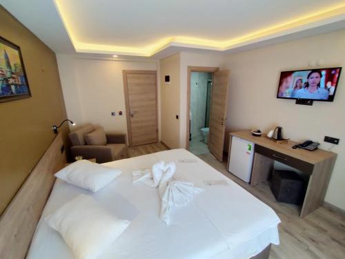 TV o dispositivi per l'intrattenimento presso Palmiye Royale Palace