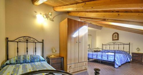 Posteľ alebo postele v izbe v ubytovaní Etna-Villa-il-Pino