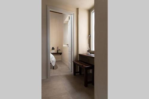 a bathroom with a sink and a mirror in a room at Petrino Naxos in Naxos Chora