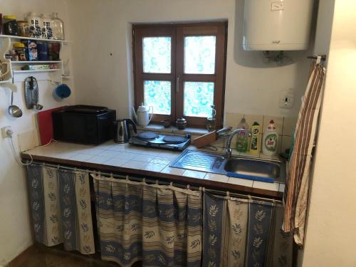 Kuchyň nebo kuchyňský kout v ubytování Penzion a vinný sklep U Slunečnice