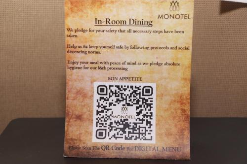 a book with a picture of a puzzle on a wall at Monotel in Kolkata