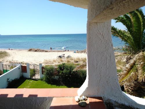 a view from the balcony of a condo overlooking the beach at In front of the beach - La terrazza sul mare in Flumini di Quartu
