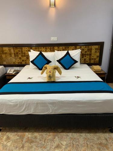 Postel nebo postele na pokoji v ubytování Blue Sand Beach Resort
