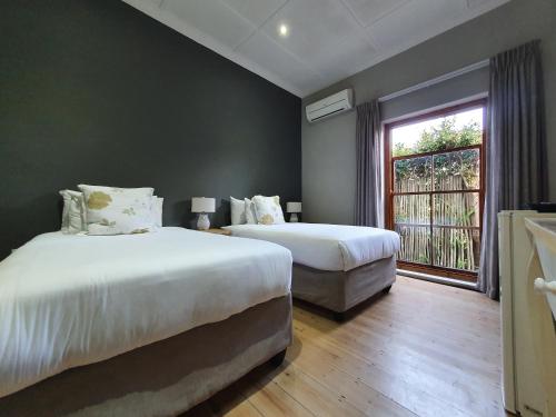 Katil atau katil-katil dalam bilik di Two Fat Owls Guesthouse