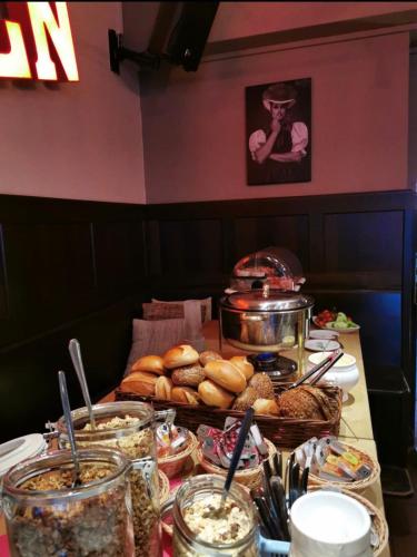 a table with a buffet of food on it at DAS Steeps Ihr Brauhaus und Hotel in Cologne