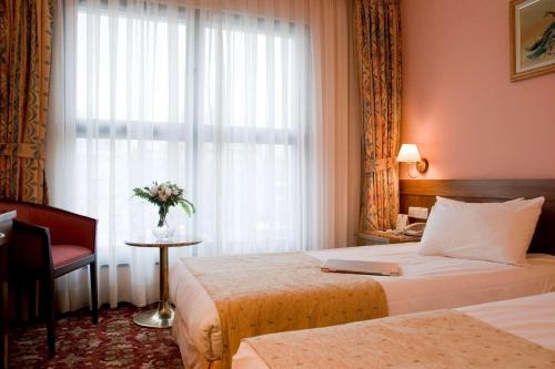 Ένα ή περισσότερα κρεβάτια σε δωμάτιο στο Hotel 2000 Kavaklıdere