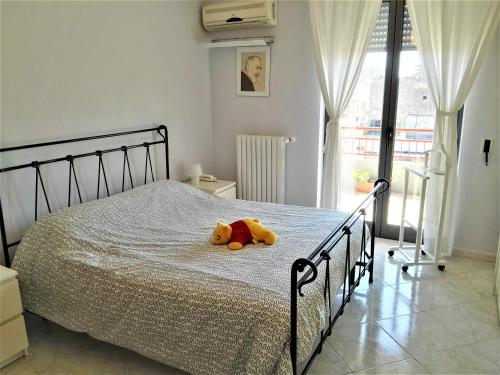 A bed or beds in a room at La Bomboniera
