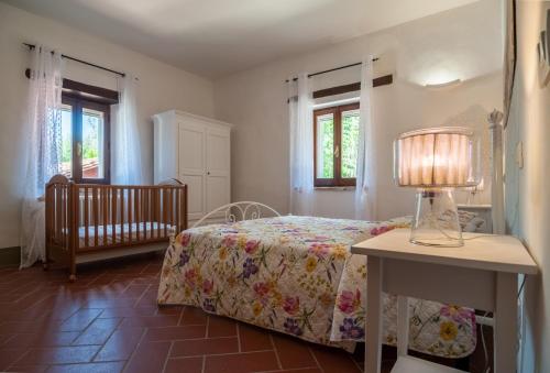 Letto o letti in una camera di Agriturismo Oasi Torre Del Colle