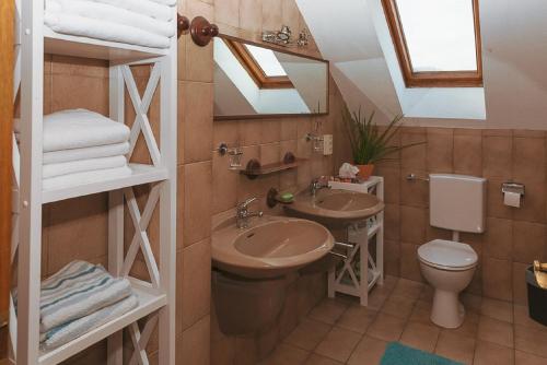 a bathroom with a sink and a toilet at Ferienwohnung Liebel in Altdorf bei Nuernberg