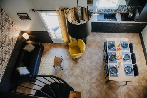 an overhead view of a kitchen and a living room at La Maison Augustine in Gap