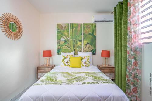 Postel nebo postele na pokoji v ubytování Le Brin d'Amour Apartment