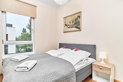 Posteľ alebo postele v izbe v ubytovaní Exclusive Apartments Marina by Noclegi Renters