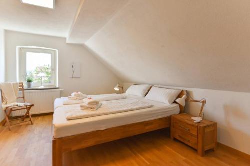 מיטה או מיטות בחדר ב-Dachgiebeloase