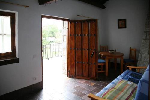 a room with a door open to a room with a table at CASA TEO in Ávila