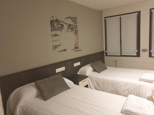 Postel nebo postele na pokoji v ubytování Hotel Arts - Gasteiz Centro