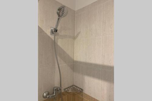 a shower with a shower head in a bathroom at Apartamento primera línea de Mar Enjoy the view in Blanes