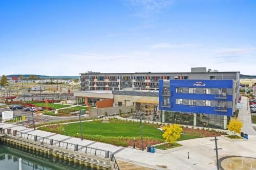 an aerial view of the sutton hotel with a river at Hotel Indigo Seattle Everett Waterfront Place by IHG in Everett