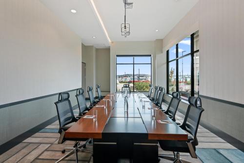 a large conference room with a long table and chairs at Hotel Indigo Seattle Everett Waterfront Place by IHG in Everett