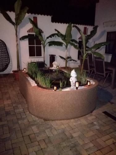 a planter with a fire hydrant in the middle of a yard at S´ Kellerstoeckl in Fehring