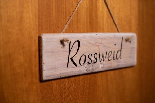 a sign that says requested hanging on a door at Hof-Tschannen in Lengwil