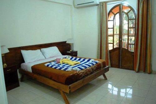 a bedroom with a bed and a window at Leyla Eco Resort in Luxor