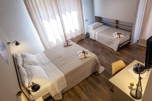 Postel nebo postele na pokoji v ubytování Five Rooms Brolo