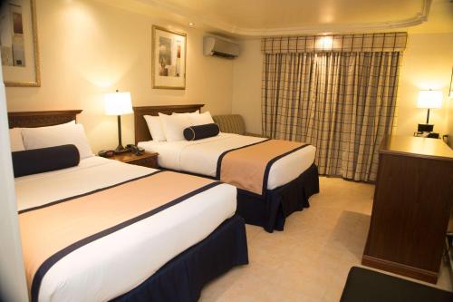 Un ou plusieurs lits dans un hébergement de l'établissement Best Western El Dorado Panama Hotel