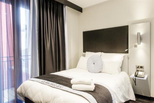 Katil atau katil-katil dalam bilik di Hôtel Boutique Richelieu, Lyon Gare Part-Dieu