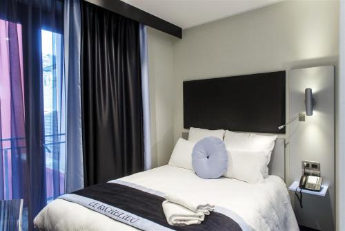 Katil atau katil-katil dalam bilik di Hôtel Boutique Richelieu, Lyon Gare Part-Dieu