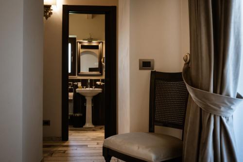 a bathroom with a sink and a mirror at Donna Carolina Luxury rooms in Cefalù