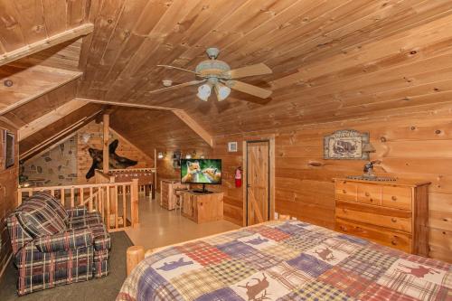 a bedroom with a bed and a ceiling fan at Kori's Mountain View, FREE tickets each paid day, Theater Room, Hot Tub, Game Room, WIFI!!! in Townsend
