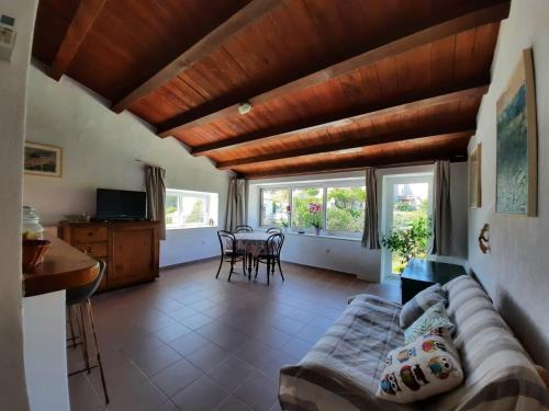 a living room with a couch and a table at Apartment Mirjana in Nerezine