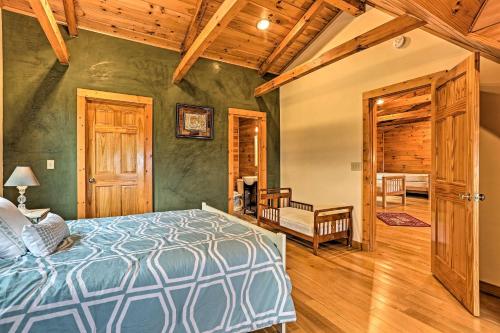 a bedroom with a bed and a wooden ceiling at Catskills Home with Deck and Game Room 14 Mi to Ski! in Prattsville