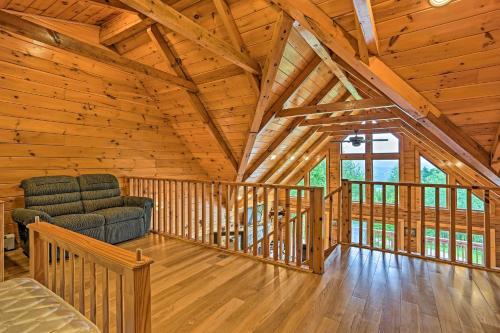 a room with a couch and a chair in a cabin at Catskills Home with Deck and Game Room 14 Mi to Ski! in Prattsville