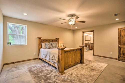 a bedroom with a bed and a ceiling fan at Secluded Home with Gas Grill, 3 Mi to Boating! in Yantis