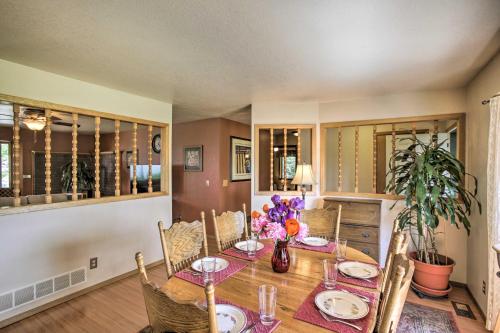 a dining room with a table and chairs at Sunny Home with Patio Less Than 10 Mi to Lake Coeur dAlene in Post Falls