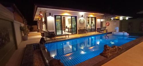 an overhead view of a swimming pool at night at Sila Thai Pool Villa2 in Ao Nang Beach