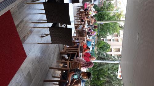 a group of people on a staircase in a building at Altunakar 1 Hotel in Didim