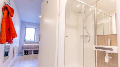 a bathroom with a shower and a sink at Heyday Student Accommodation in Dublin
