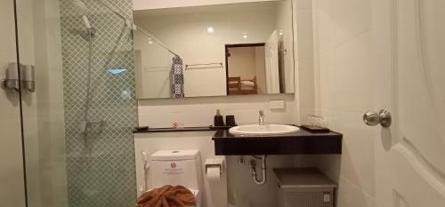 a small bathroom with a sink and a mirror at Sila Thai Pool Villa2 in Ao Nang Beach