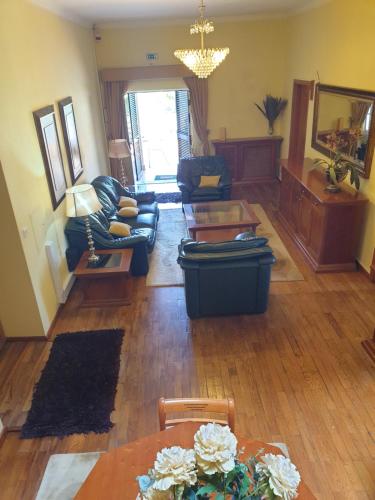 a living room with a couch and a table at hostel do Ermal in Vieira do Minho