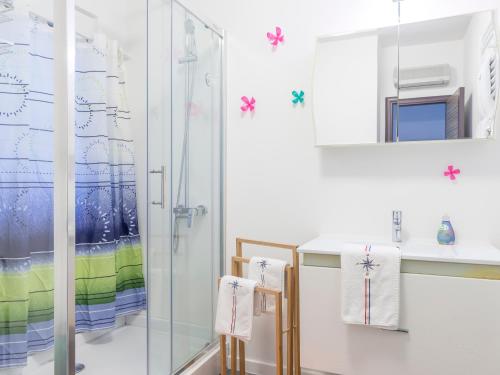 a bathroom with a shower and a sink at Apartments Windrose in Kotor