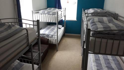 Ένα ή περισσότερα κρεβάτια σε δωμάτιο στο Blue Room Hostel Newquay